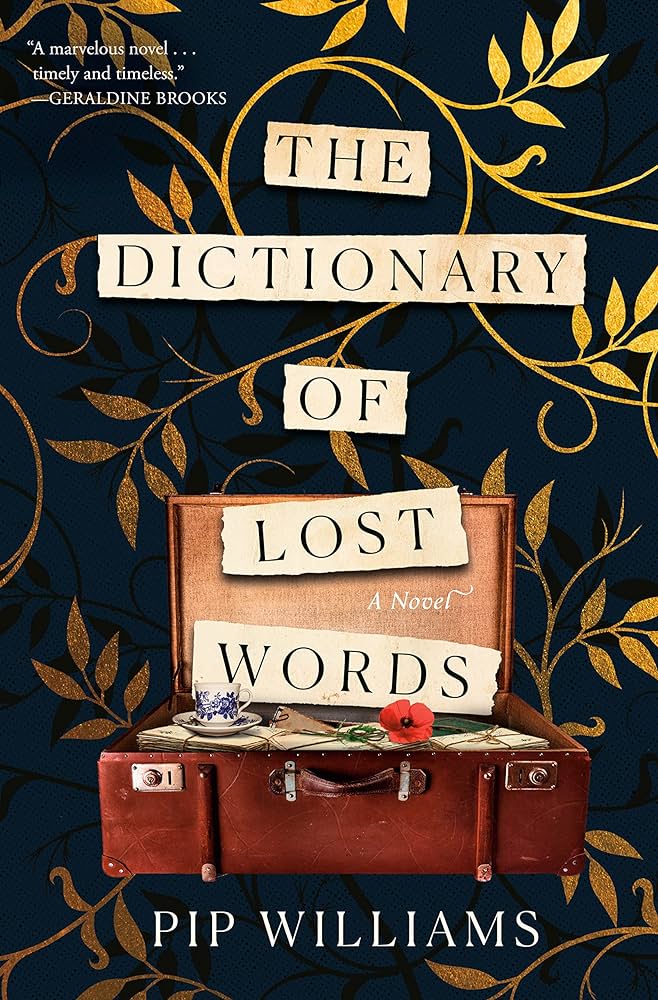 Suitcase with paper slips coming out that read The Dictionary Of Lost Words