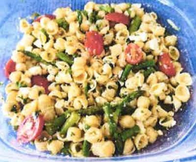 glass bowl filled with gremolata pasta salad with asparagus