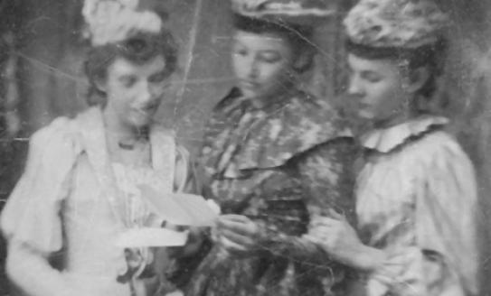 Three women reading a letter, early 1900s, believed to be from Kingsley MI