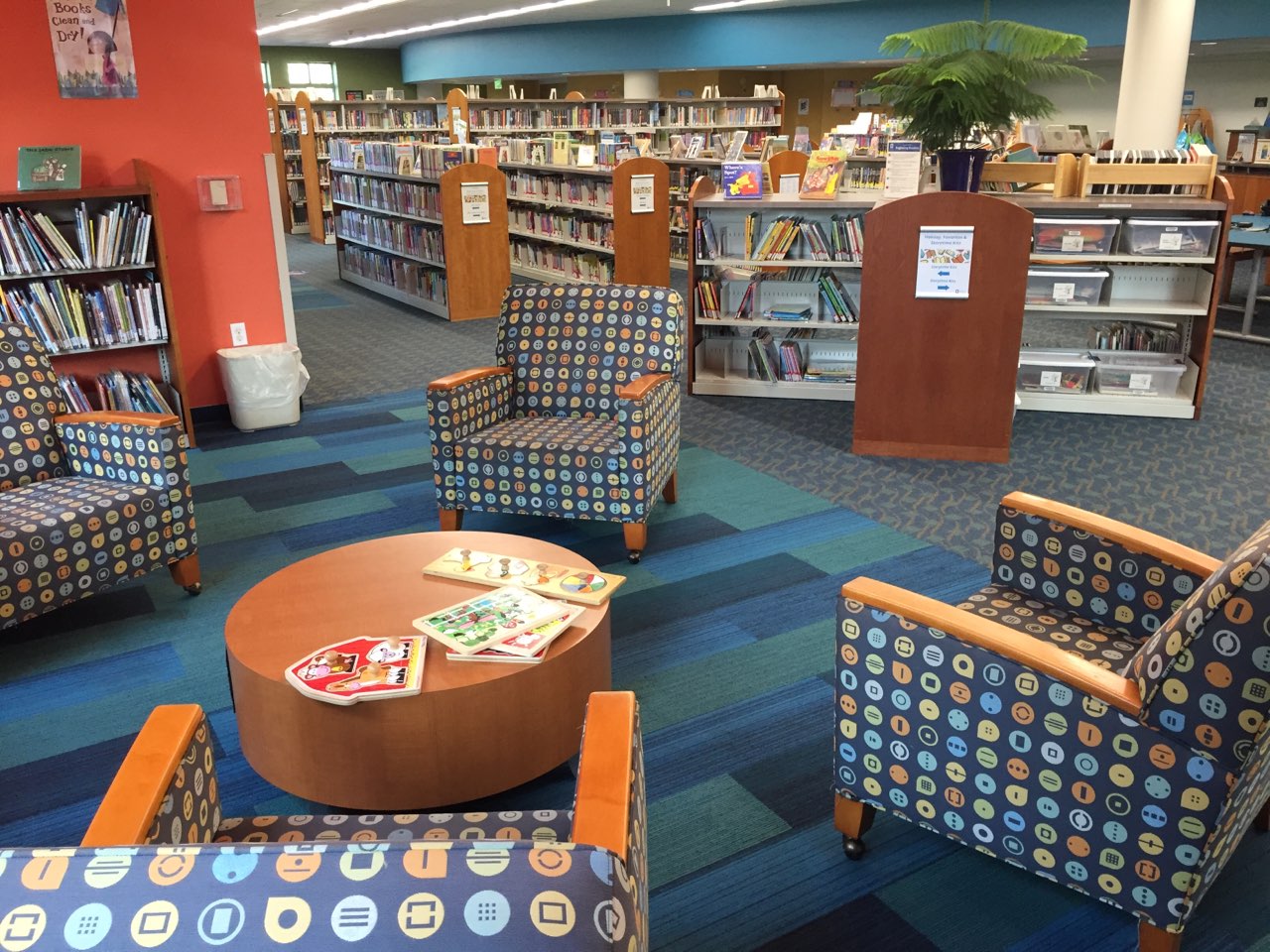 Chairs and table in reading area of Youth Services