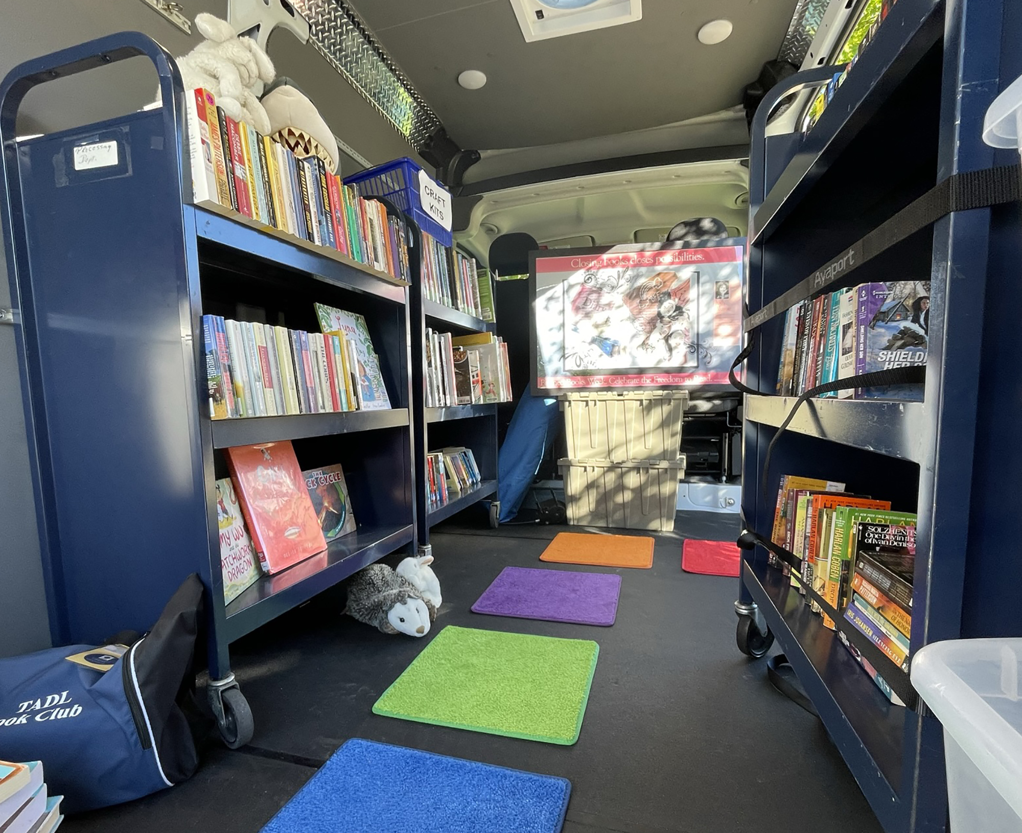 Bookmobile with book carts on both sides