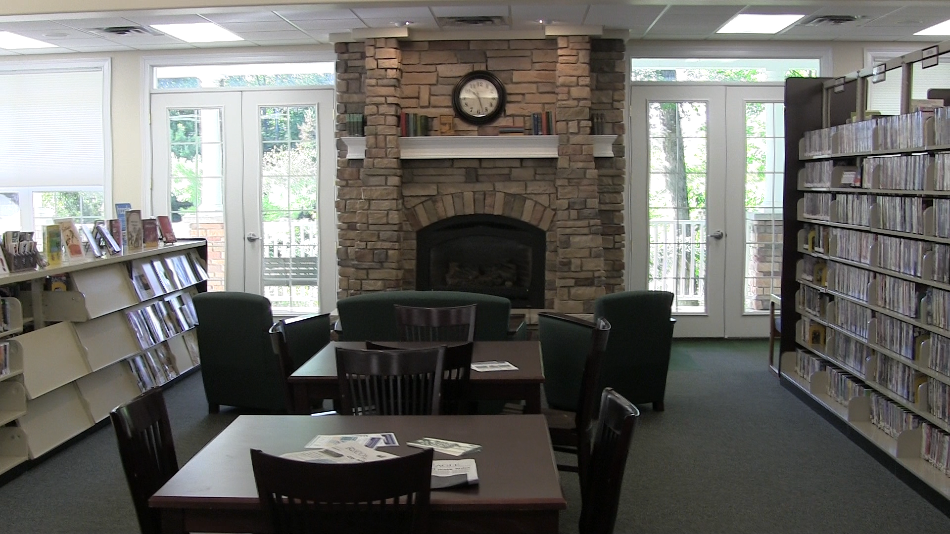 Library with stone fireplace