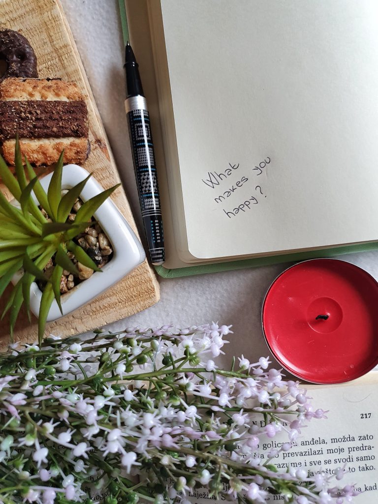 notebook, candle, plant, snack
