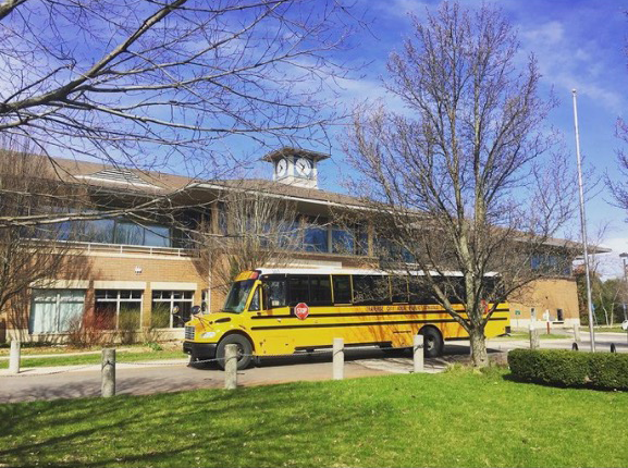 TCAPS school bus parked in front of the library