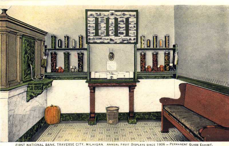 Color postcard of First National Bank lobby with fruit display