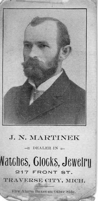 Portrait of Jeweler J.N. Martinek, Newspaper clipping locating the store at 217 E. From Street