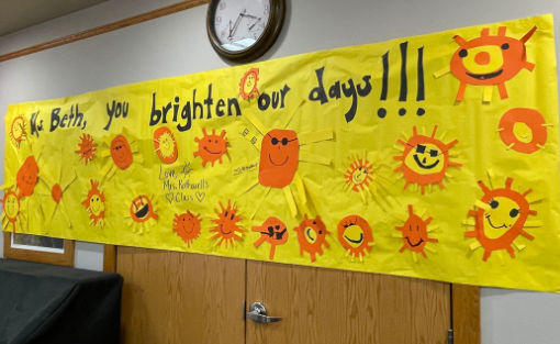 A bright yellow sunshine banner made by Kingsley Elementary students.