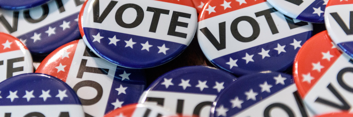 A pile of buttons saying Vote