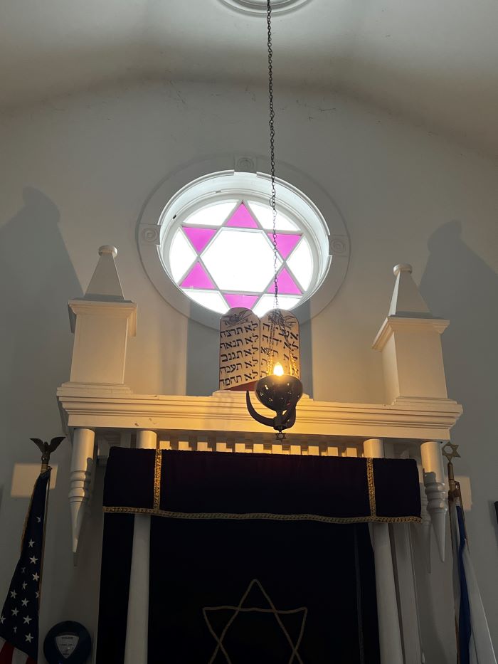 Photograph of the star stained glass window above the torah ark