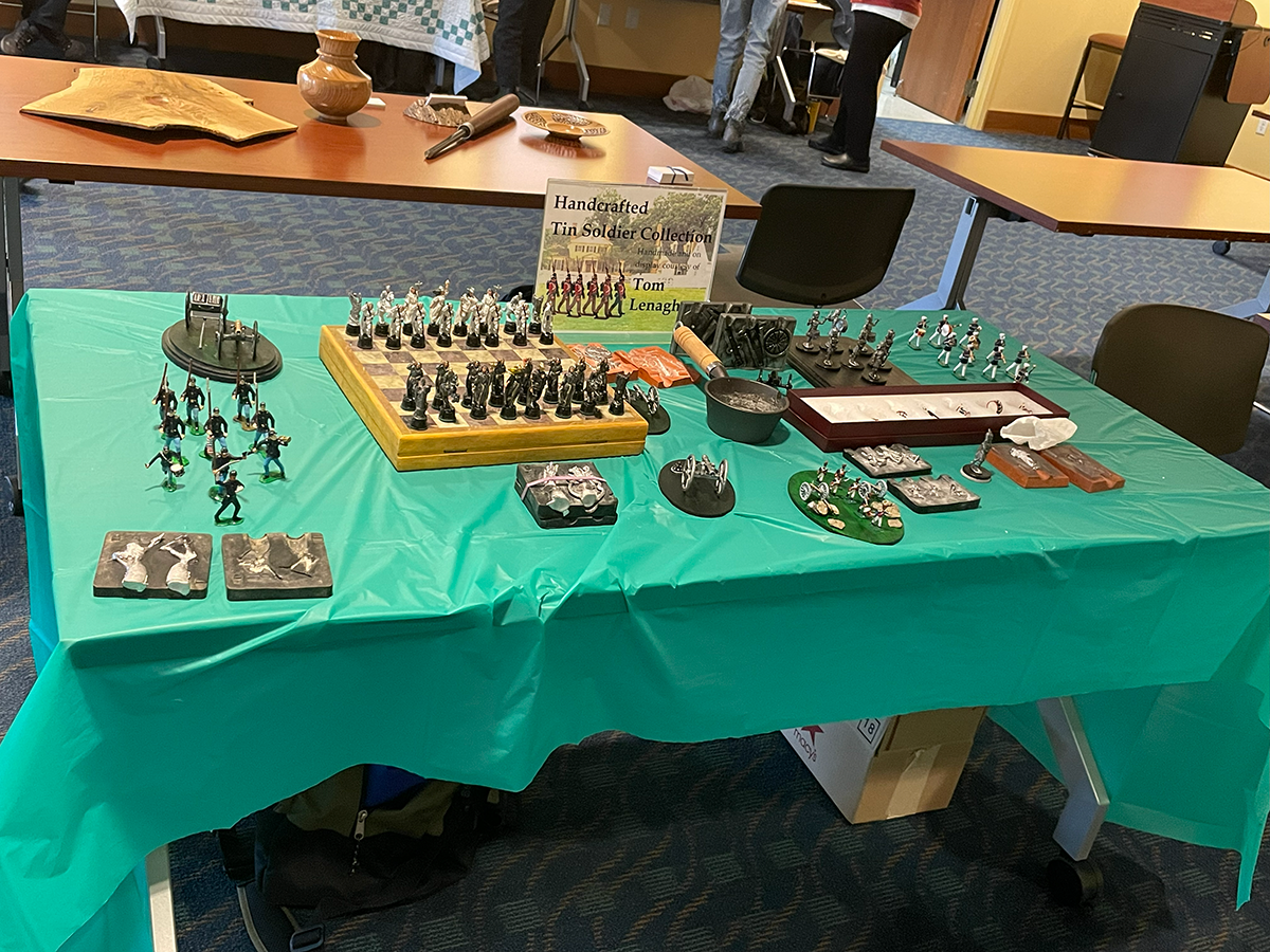 display of miniature cast pewter figures and molds