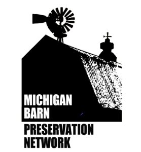 Silhouette of a barn with a windmill and weathervane