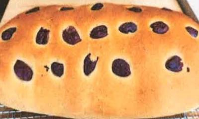 loaf of eliopsomos greek olive bread