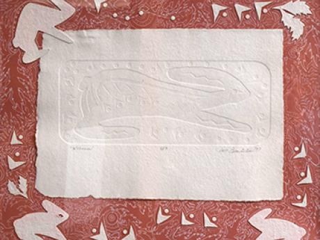 Paper block print of running rabbit. 