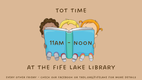 Three toddlers reading a book