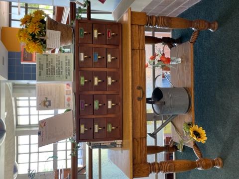 picture of an old library card catalog, which now holds packets of seeds