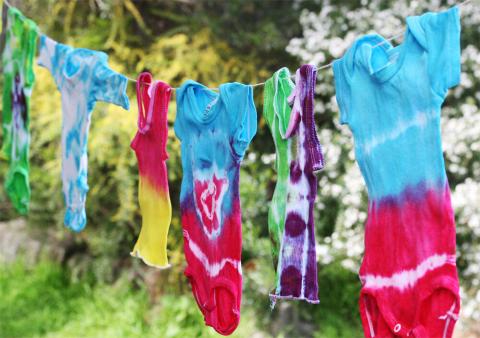 Tie dye shirts hanging on a clothes line