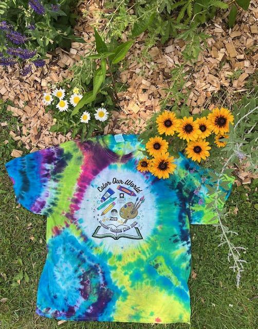 Tie dyed t-shirt near some flowers