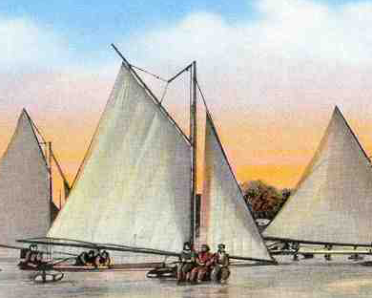 Cropped colored postcard showing ice boats on Traverse Bay (c. 1915)