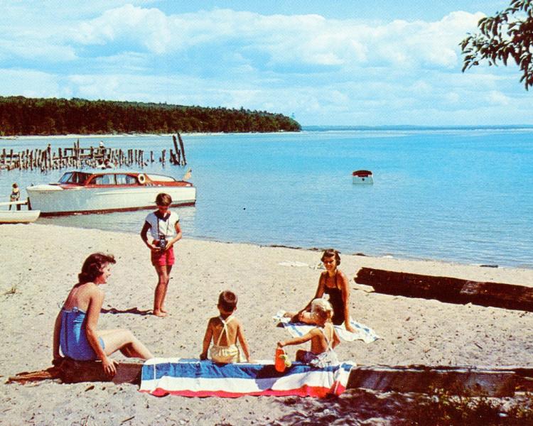 Vintage photo of a family at the beach