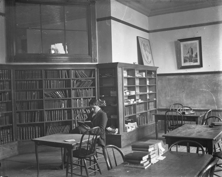 Black and white photo of a library reading room