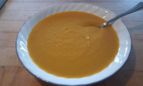 bowl of autumn harvest soup with spoon