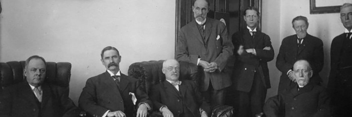 Black and white photo of a group of men, the Traverse City State Hospital Board of Directors, in 1909