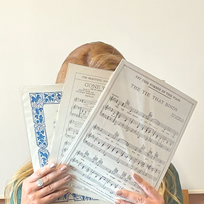 Headshot of Christina Meyers, Head of Circulation, holding sheet music
